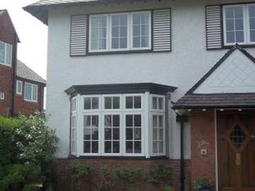 MEOLS, WIRRAL - Installtion of Tudor storm 2 Evolution PvcU windows. Double glazed with 28mm A rated units. All windows to match existing which included providing the outer frame in black with white mulions and sashes 